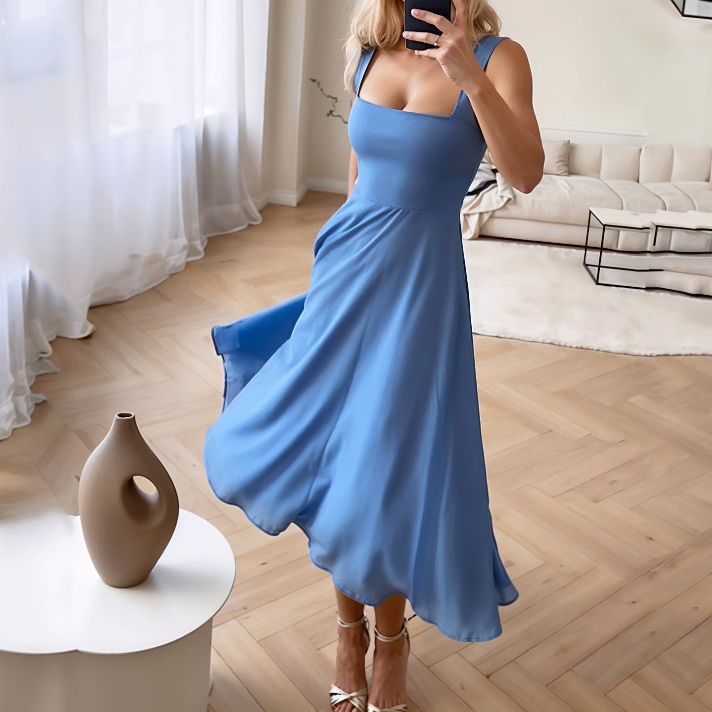 Classic midi dress in blue with square neckline and flowy skirt, providing a stylish and elegant look for women. A perfect women's dress for various occasions.