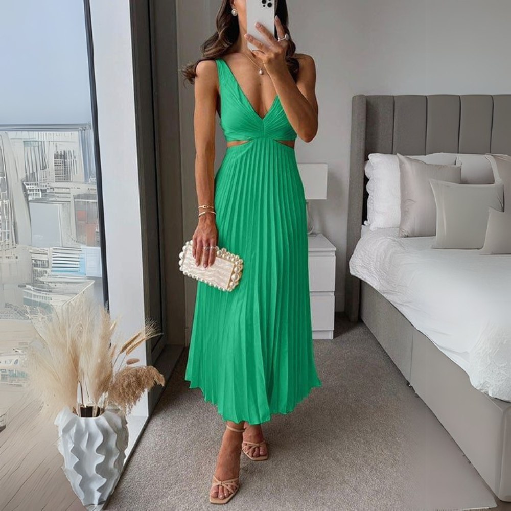 Stylish pleated midi dress in green with trendy cutout design for women. A refreshing women's dress perfect for vibrant looks.