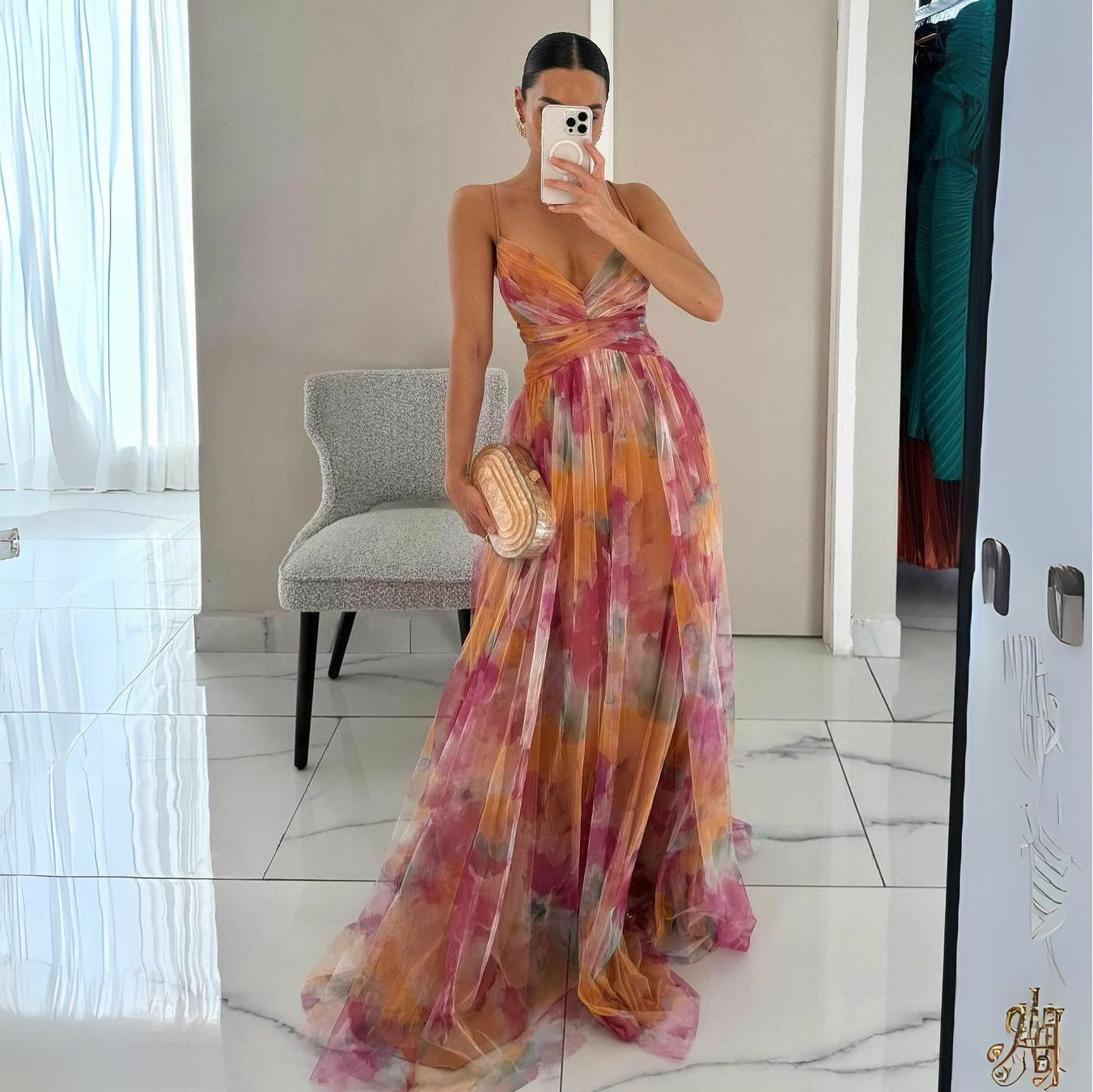 Flowy floral print maxi dress with V-neck for women in vibrant orange tones, perfect for a stylish and comfortable look.