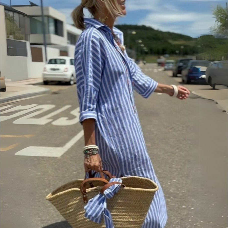 Blue striped oversized beach shirt dress for women with a button-down design, ideal for a casual beach day.