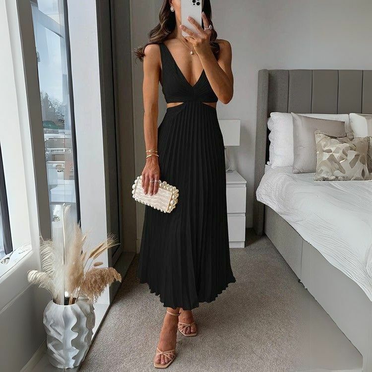 Stylish pleated midi dress in black with trendy cutout design for women. Perfect for formal or casual occasions, a versatile women's dress.