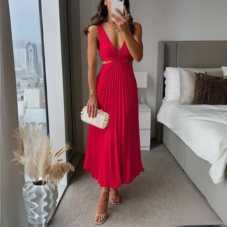 Stylish pleated midi dress in red with trendy cutout design for women. A bold and chic women's dress suitable for any occasion.